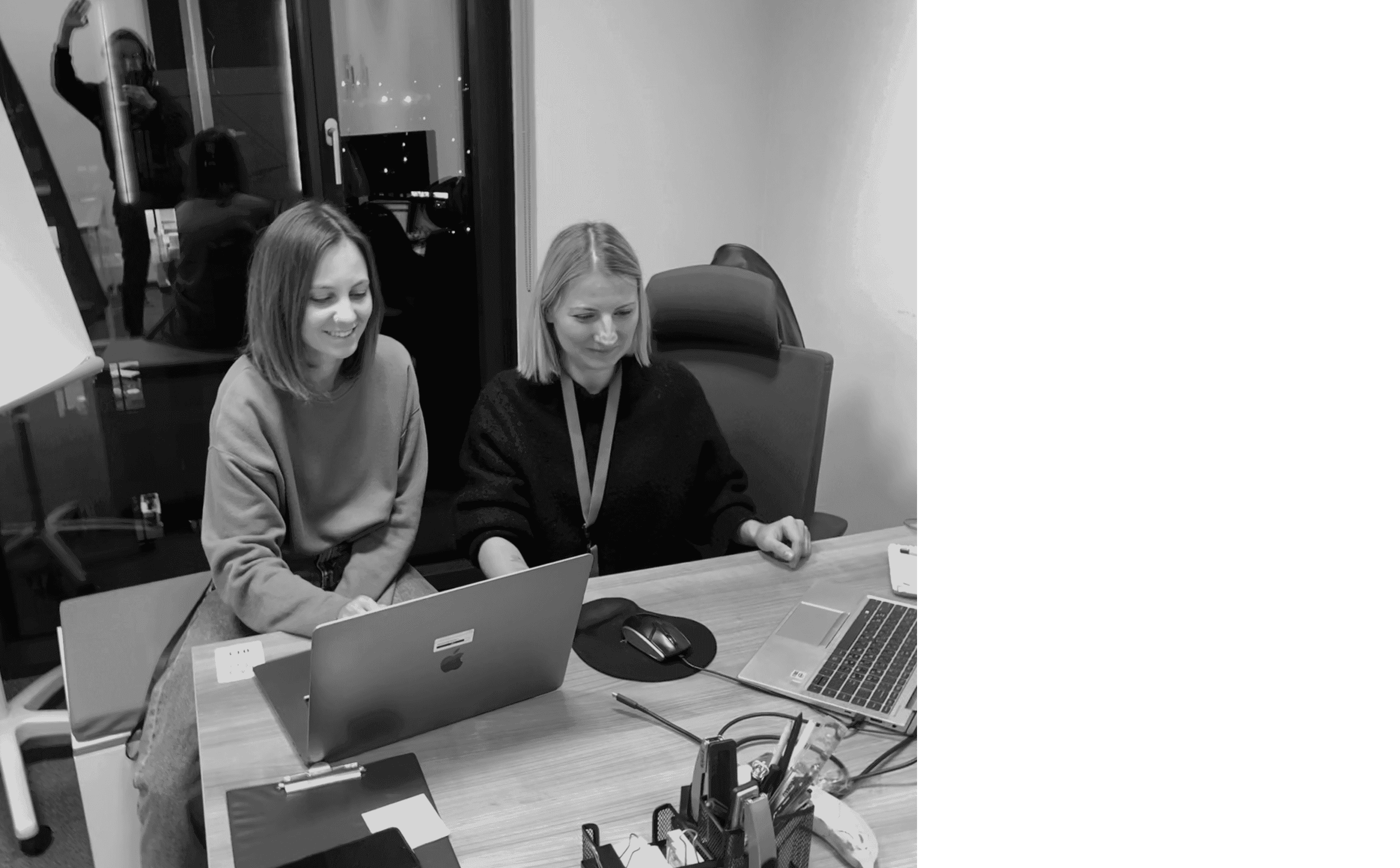 Two researchers running a moderated session on a laptop.